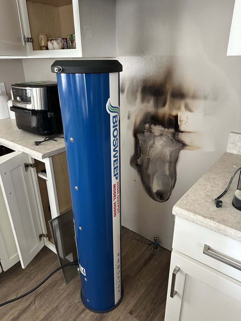 BIOSWEEP machine deployed in a Chicagoland kitchen with visible fire damage, mid-treatment